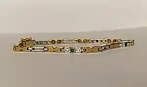 Schakelarmband van 18-karaats tweekleurig goud met edelstenen kopen? Bied vanaf 1350!