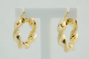 80- paar 18 Krt geel gouden holle & "gedraaide" oorringen kopen? Bied vanaf 200!