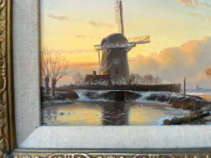 Anton Karssen - Winters landschap met vrouw op een pad bij een molen kopen? Bied vanaf 390!