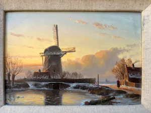 Anton Karssen - Winters landschap met vrouw op een pad bij een molen kopen? Bied vanaf 390!