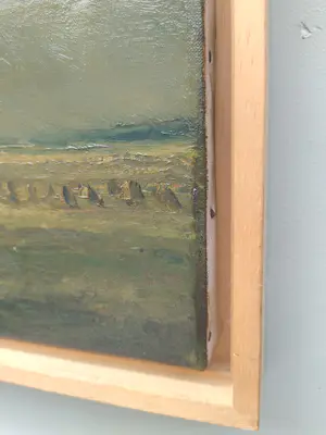 Ad van der Kop - Polderlandschap met korenschoven onder een dreigende lucht kopen? Bied vanaf 45!