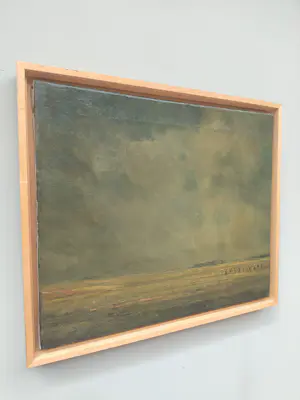 Ad van der Kop - Polderlandschap met korenschoven onder een dreigende lucht kopen? Bied vanaf 45!