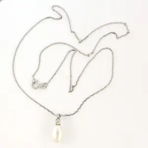 14k witgouden collier en hanger met parel en diamant 0.10ct kopen? Bied vanaf 340!