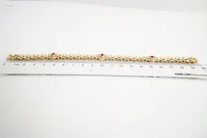 99- 18 karaats geel-gouden dames armband gezet met rode edelsteen kopen? Bied vanaf 770!