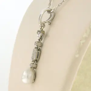 14k witgouden collier met hanger bezet met parel en diamant kopen? Bied vanaf 250!