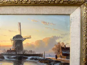 Anton Karssen - Winters landschap met vrouw op een pad bij een molen kopen? Bied vanaf 390!