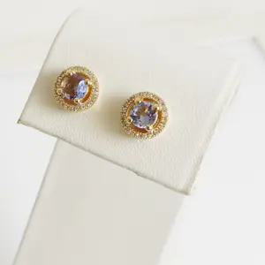 Oorbellen van tanzaniet met een diamanten halo. kopen? Bied vanaf 700!