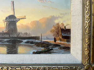 Anton Karssen - Winters landschap met vrouw op een pad bij een molen kopen? Bied vanaf 390!
