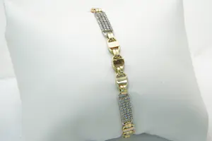 69 - 14 karaats bicolor gouden armband met tussen plaatjes gezet met steentjes kopen? Bied vanaf 560!