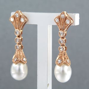 14k rosé gouden oorhangers bezet met parel en 8 kant geslepen diamant tot.0.34ct kopen? Bied vanaf 440!