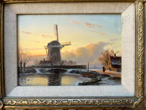 Anton Karssen - Winters landschap met vrouw op een pad bij een molen kopen? Bied vanaf 390!