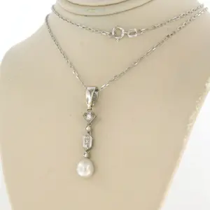 14k witgouden collier met hanger bezet met parel en diamant kopen? Bied vanaf 250!