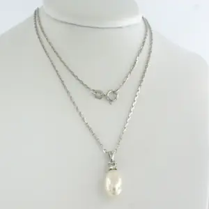 14k witgouden collier en hanger met parel en diamant 0.10ct kopen? Bied vanaf 340!
